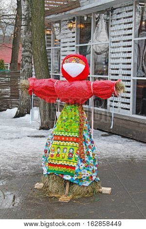 MOSCOW - MARCH 13 2016: Shrovetide doll in traditional clothes in holiday of Shrovetide in the park Hermitage in Moscow