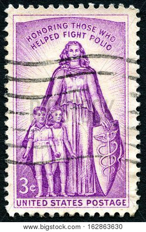 UNITED STATES OF AMERICA - CIRCA 1957: A used postage stamp from the USA honoring those who have helped fight Polio circa 1957.