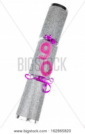 A shot of a 90th Birthday Cracker or otherwise known as a Bon Bon. A traditional cracker consists of a cardboard tube wrapped in a brightly decorated twist of paper with a gift in the central chamber.