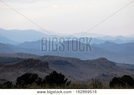 Colorado hills melting into the distant haze
