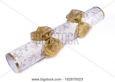 A studio shot of a Christmas Cracker or otherwise known as a Bon Bon. A traditional cracker consists of a cardboard tube wrapped in a brightly decorated twist of paper with a gift in the central chamber.