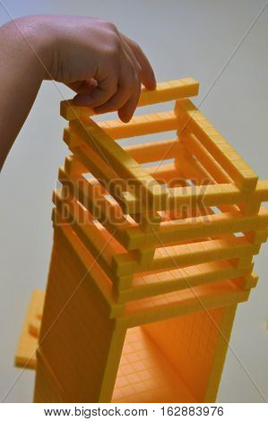 hands base ten blocks yellow little girl learning stacking building playing educational