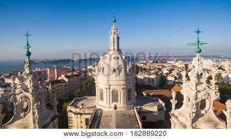 Dome of the Estrela Basilica on a background of Lisbon at morning