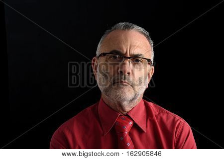 Portrait of a middle aged man on black