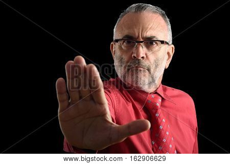 Man with stop sign with black background