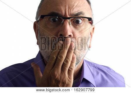 Man with hand in mouth with a white background