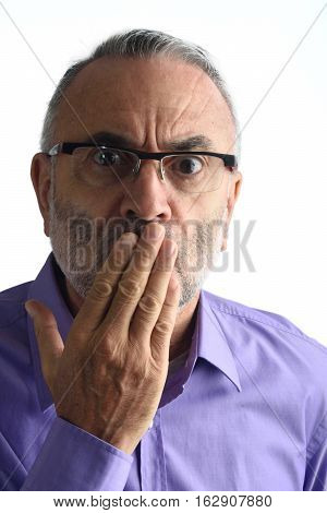 Man with hand in mouth with a white background
