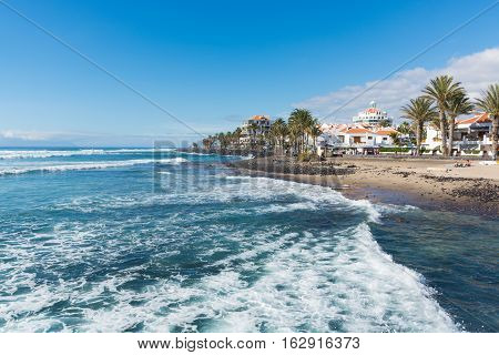 Ocean coast in the tourist resort Playa de las Americas Tenerife island Canary Islands Spain winter sun travel