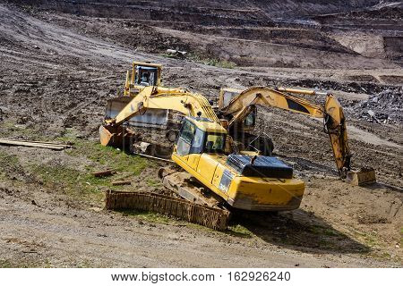 Construction machinery. Excavation work at the construction site.