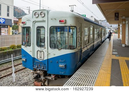 TOKYO, JAPAN - 20 NOV 2016 : Train stopped at Fujikyu Railway station.The railway system is one of the most important public transportation in Japan.