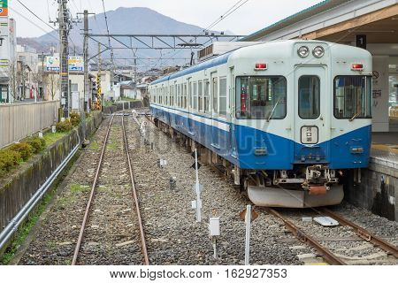 TOKYO, JAPAN - 20 NOV 2016 : Train stopped at Fujikyu Railway station.The railway system is one of the most important public transportation in Japan.