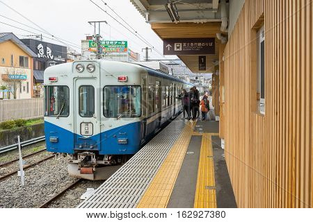 TOKYO, JAPAN - 20 NOV 2016 : Train stopped at Fujikyu Railway station.The railway system is one of the most important public transportation in Japan.