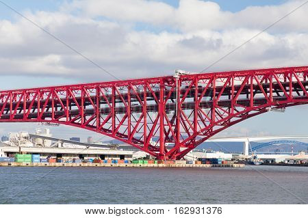 Red double-deck cantilever truss bridge, Minato Bridge in Osaka Japan