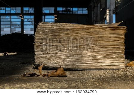 open old book in an abandoned factory