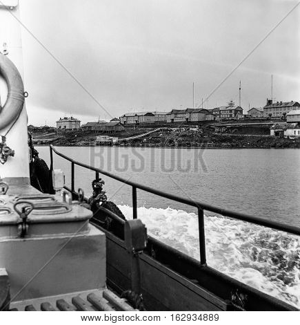 View of the island village of Dickson on Board a boat on a cloudy day. Photo of the late 1970-ies.