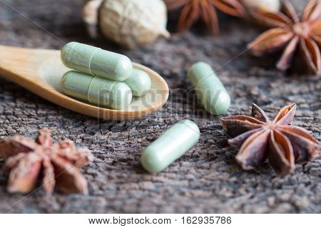 Green Herb Powder Capsules And Erlenmeyer Flask