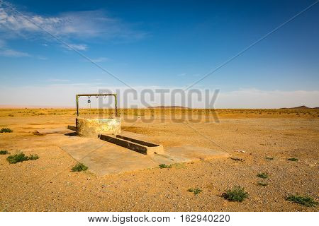 Waterhole For Camels In The Reg Desert
