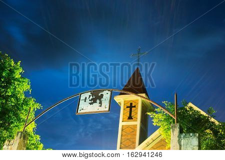 Entrance to Gothic Church glowing at Night
