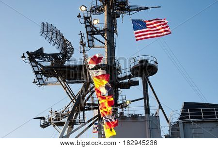 The mast and ships flags on the USS midway museum in San Diego California.