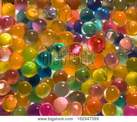 many colored hydrogel beads beautiful bright background