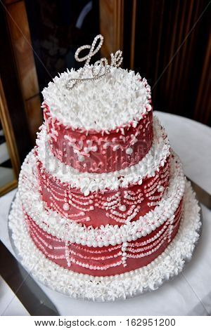 wedding red white cake on a table