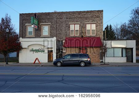 CADILLAC, MICHIGAN / UNITED STATES - NOVEMBER 27, 2016: One may drink alcoholic beverages, and listen to music, at the Mitchell Street Pub, and at the Cadillac Party Lounge, in Cadillac.