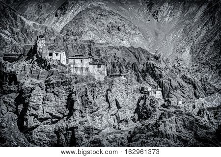 Ruins and Basgo Monastery surrounded with stones and rocks Leh Ladakh Jammu and Kashmir India. Black and white image.