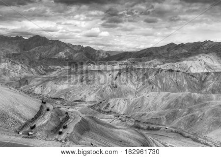 Aerial view of Zigzag road - famously known as jilabi road at old route of Leh Srinagar Highway Ladakh Jammu and Kashmir India. Black and white image.