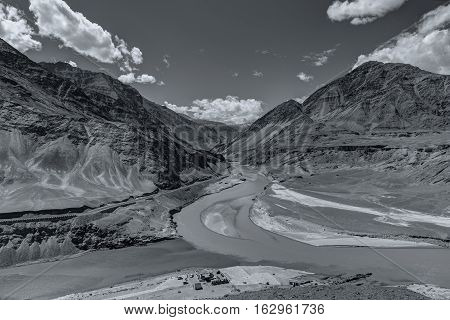Scenic view of Confluence of Zanskar and Indus rivers - Leh Ladakh Jammu and Kashmir India. Black and white image.