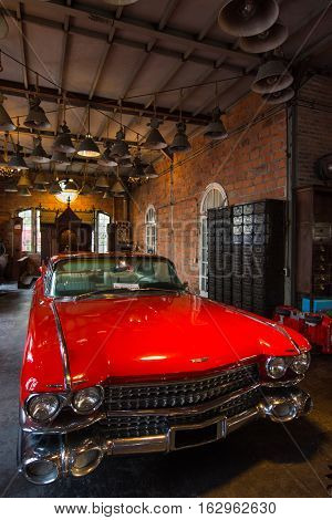 BANGKOK THAILAND - SEPTEMBER 17 2016: Old vintage red car at Night market Srinakarin road that name is train market. This market is open every Wednesday to sunday.