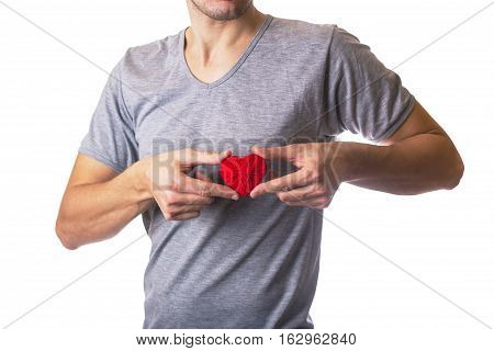 Man holding red wool heart. White isolated