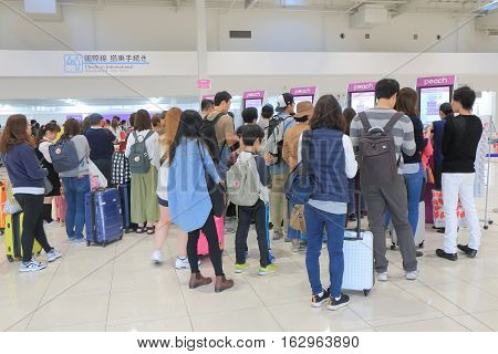 OSAKA JAPAN - OCTOBER 18, 2016, 2016: Unidentified people check in at Peach airline counter Kanasai airport. Peach airline is a LCC based in Kansai airport.