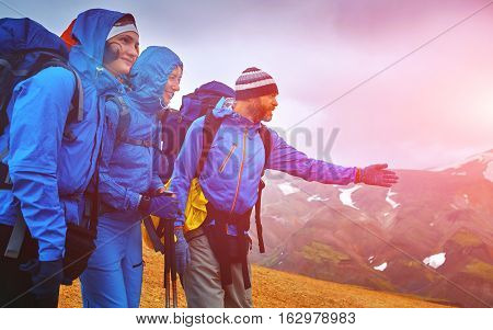 hikers on the trail in the Islandic mountains. Trek in National Park Landmannalaugar, Iceland