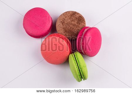 Macaroons for dessert on a white background shot closeup
