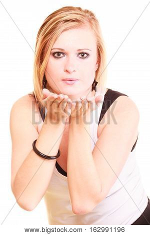 Gesture flirt coquet concept. Beautiful blonde woman sending air kiss. Studio shot isolated.