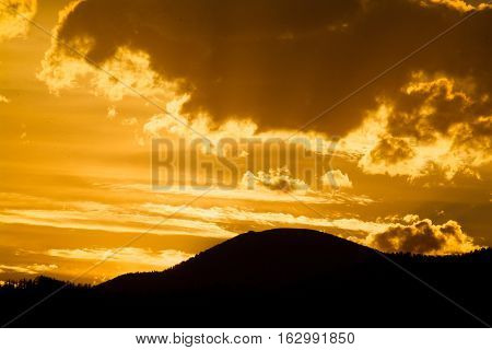 Sun seting over the Sayan mountains at tayga