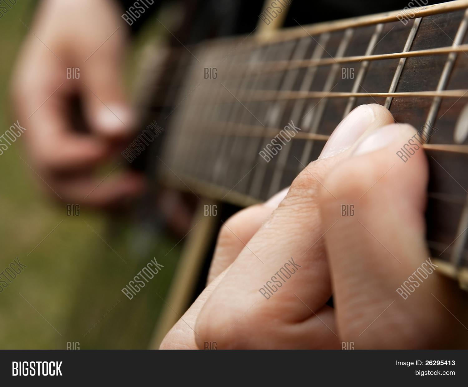 Fingers Of A Guitar Player Shallow Dof Socus Is On The Finger Holding The Fingers Of A Guitar Player Shallow Dof Socus Is On The Finger Holding The