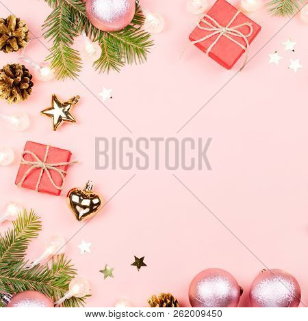 Christmas Background With Fir Branches, Lights, Red Giftboxes, Pink Decorations, Hot Drink With Mars