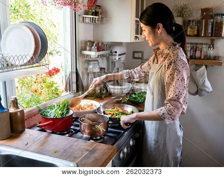 Woman cooking lunch in a kitchen