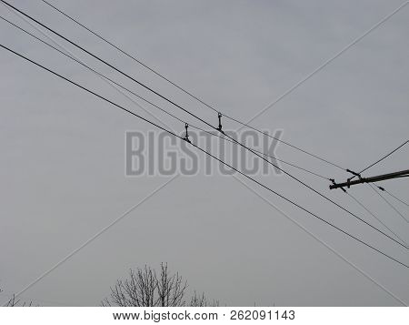 Wires Pole With Blue Sky. Electrical Wires On A Background. Electric Cables. Power Cable With Blue S