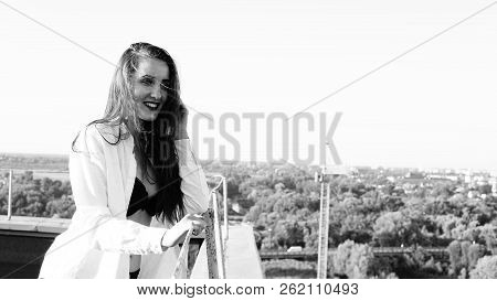 Young Sexy Woman Posing In The Roof, Wearing Leater Jacket, Swag Floral Hat Mirrored Sunglasses And 