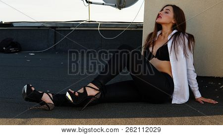 Young Sexy Woman Posing In The Roof, Wearing Leater Jacket, Swag Floral Hat Mirrored Sunglasses And 