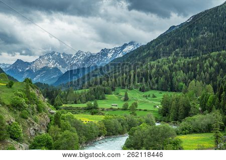 Lavin, Switzerland, May 13, 2018. Beautiful view of Lavin municipality situated on the Inn river bank between mountains.