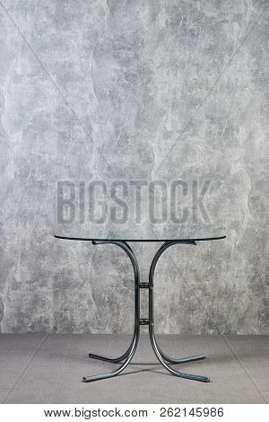 Modern Glass Table Top On Gray Texrure Wall Background