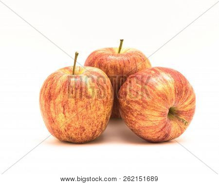 Close-up Three Raw Organic Gala Apples Isolated On White