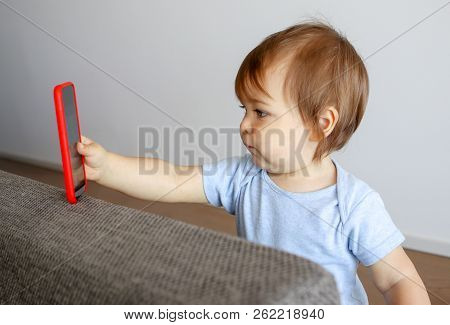 Cute Little Baby Taking Selfie Holding Smartphone In His Hand, Child And Gadget Concept, New Generat