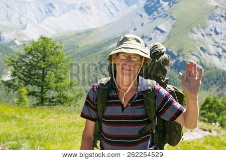 A Tourist Waving His Hand In Greeting.