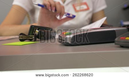 Human Hand Applies A Credit Card In Pos Terminal. Detail Of The Card. Credit Card Machine For Money 