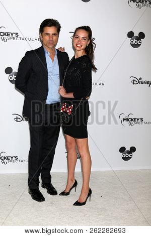 LOS ANGELES - OCT 6:  John Stamos, Caitlin McHugh at the Mickey's 90th Spectacular Taping at the Shrine Auditorium on October 6, 2018 in Los Angeles, CA