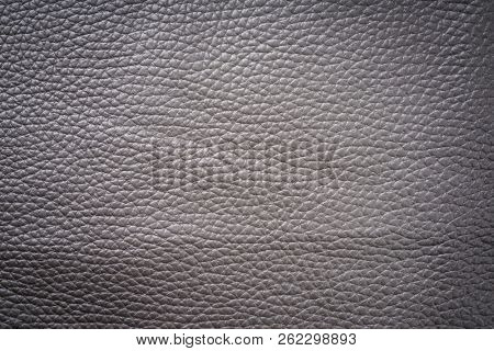 Brown genuine leather as background wallpaper with copy space 